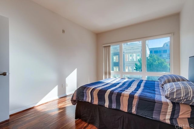 bedroom with hardwood / wood-style floors