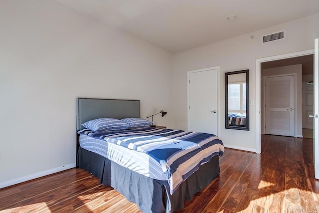 bedroom featuring dark hardwood / wood-style floors