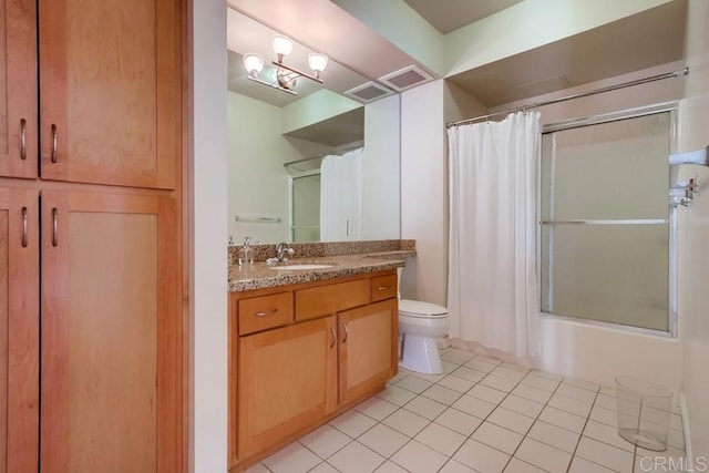 full bathroom featuring toilet, tile patterned flooring, vanity, and shower / bath combo with shower curtain