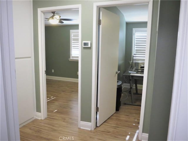 hall with light wood-type flooring