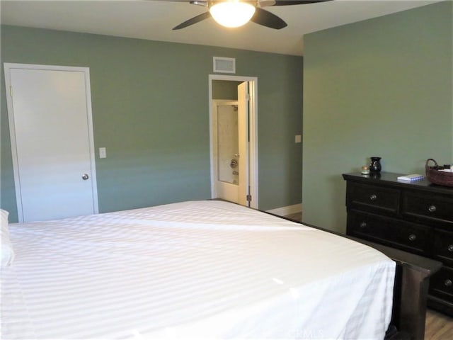 bedroom with ceiling fan and wood-type flooring