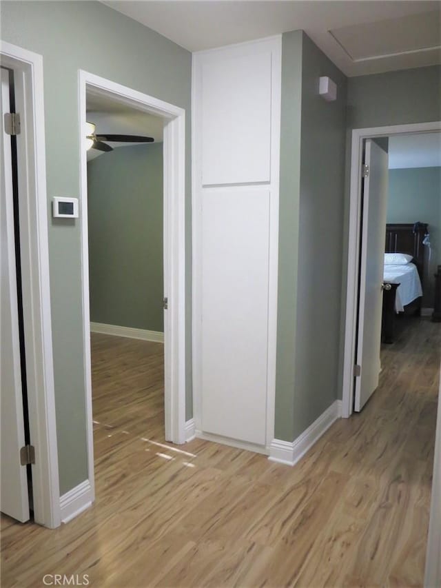 hallway with light wood-type flooring