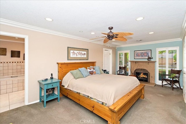 bedroom featuring carpet floors, ceiling fan, multiple windows, connected bathroom, and ornamental molding