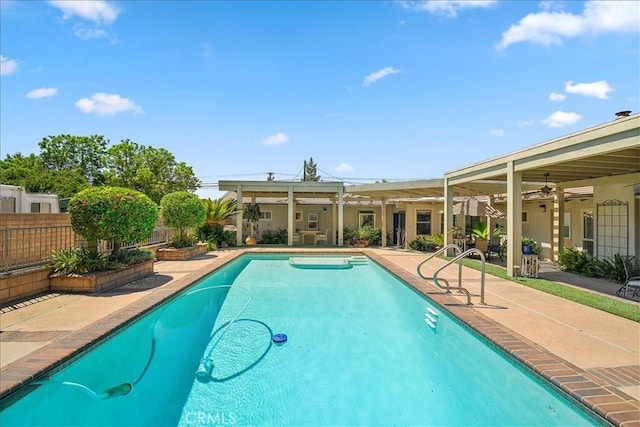 view of swimming pool with a patio area and ceiling fan