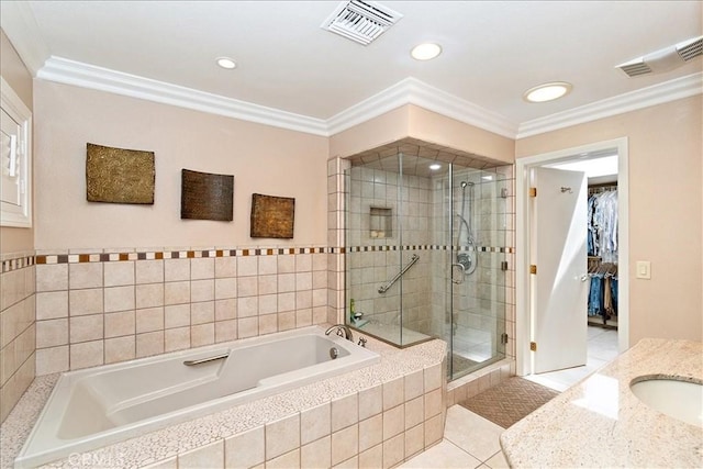 bathroom with plus walk in shower, tile patterned floors, and ornamental molding