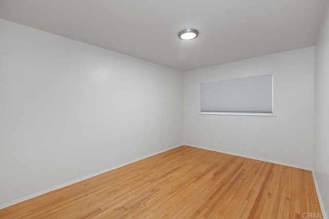 spare room featuring light wood-type flooring