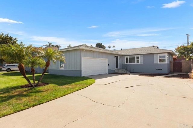 ranch-style house with a garage and a front lawn