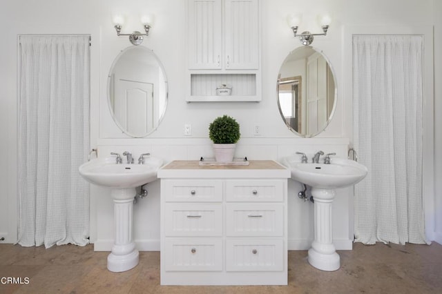 bathroom featuring double sink