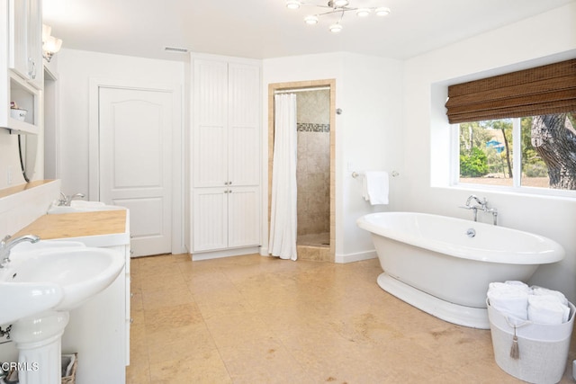 bathroom with independent shower and bath