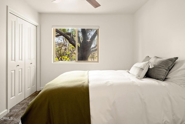 carpeted bedroom featuring ceiling fan and a closet