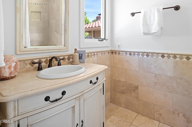 bathroom with tile walls and vanity