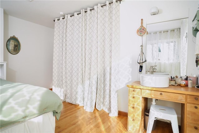 bedroom with wood-type flooring