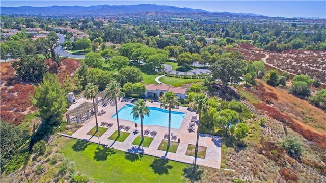 birds eye view of property with a mountain view