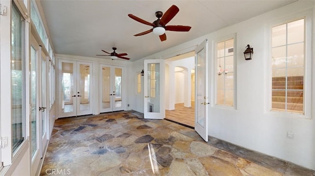 unfurnished sunroom featuring french doors