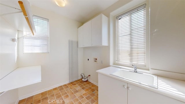 laundry room with cabinets, washer hookup, sink, and electric dryer hookup