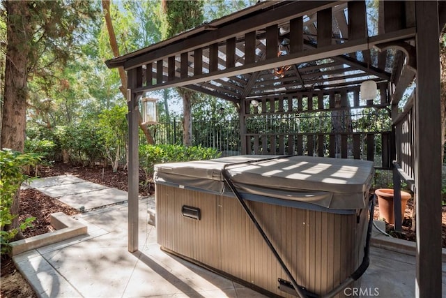 view of patio / terrace featuring a gazebo and a hot tub