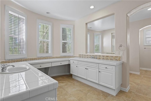 bathroom featuring tile patterned floors and vanity