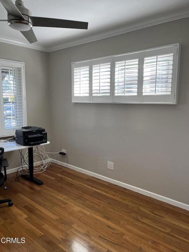 office space with ceiling fan, dark wood-type flooring, and crown molding