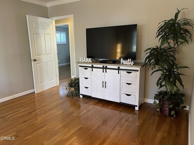 living room featuring ornamental molding and dark hardwood / wood-style flooring