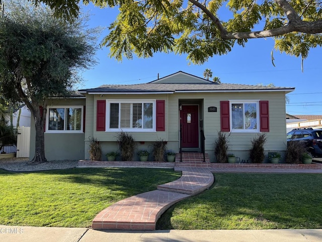 single story home with a front yard