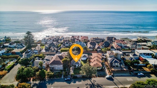 aerial view featuring a water view and a beach view