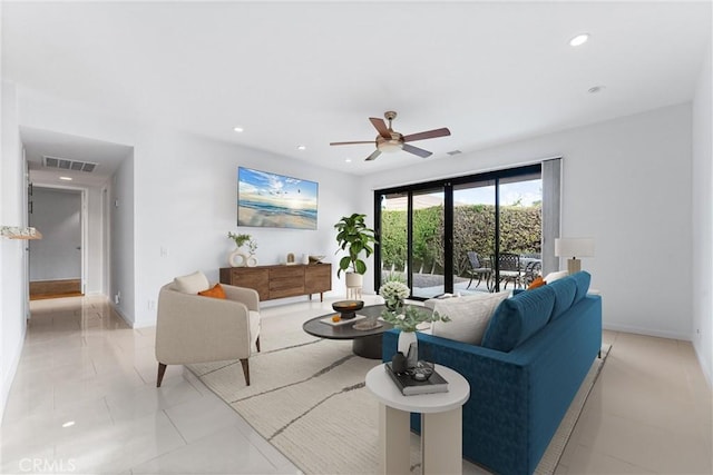 living room with ceiling fan and light tile patterned floors