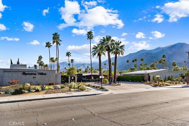 community / neighborhood sign featuring a mountain view