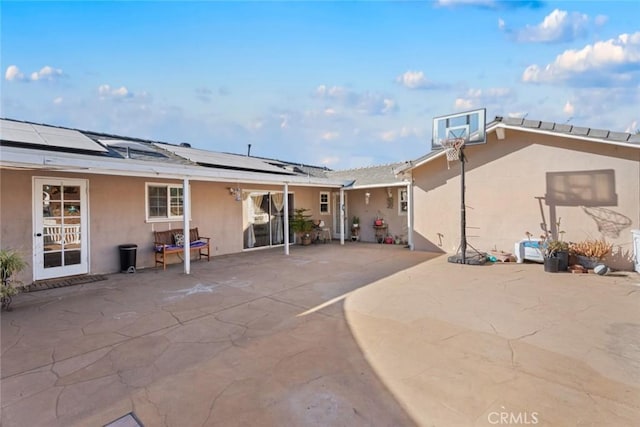 exterior space with a patio area and solar panels