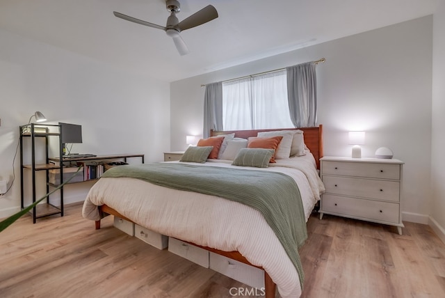 bedroom featuring light hardwood / wood-style floors and ceiling fan