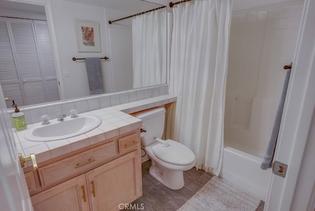 full bathroom featuring toilet, vanity, and shower / tub combo with curtain