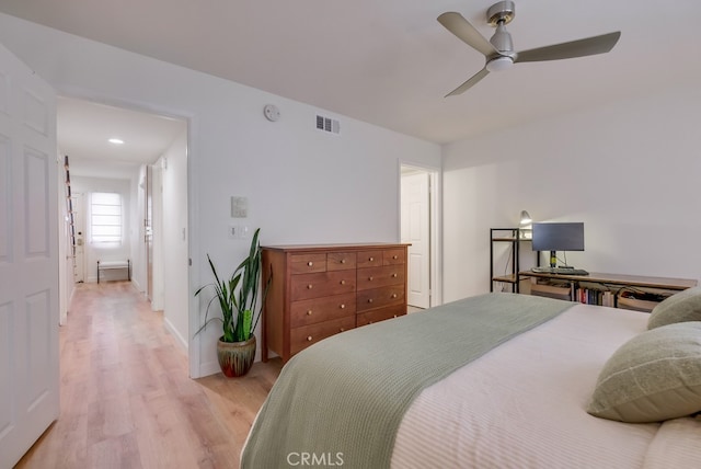 bedroom featuring ceiling fan and light hardwood / wood-style floors