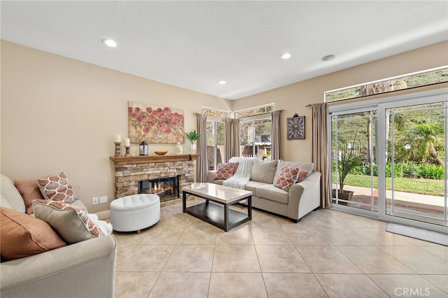 living room featuring recessed lighting, a fireplace, and light tile patterned floors