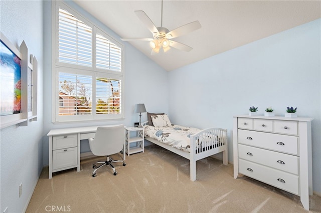 bedroom with a ceiling fan, lofted ceiling, and light carpet