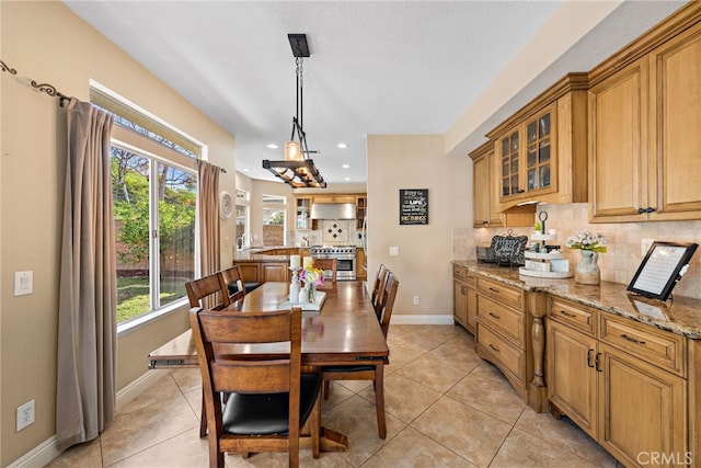 dining space with light tile patterned floors, recessed lighting, and baseboards