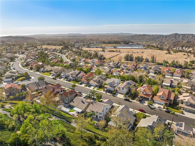 drone / aerial view with a residential view and a mountain view