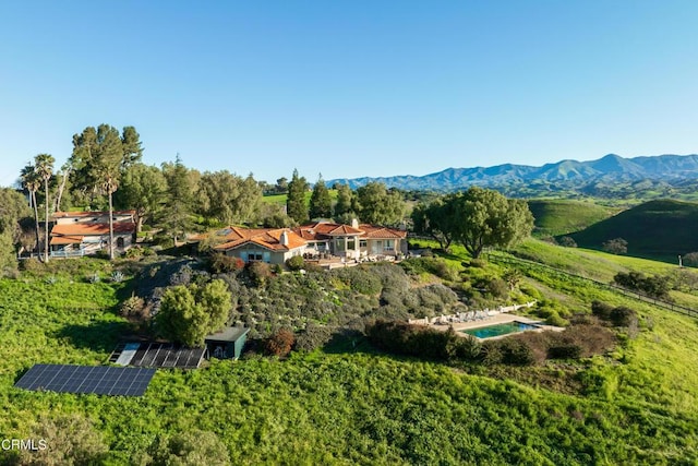 birds eye view of property with a mountain view