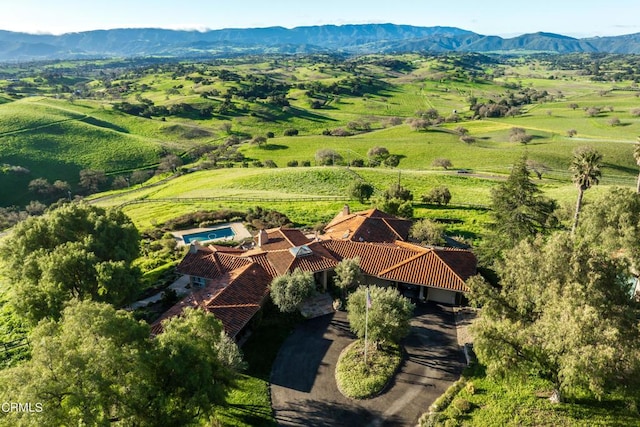 birds eye view of property featuring a rural view and a mountain view