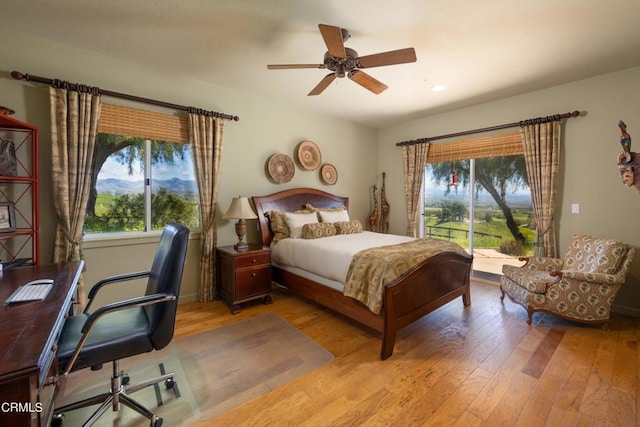 bedroom with access to outside, ceiling fan, and light hardwood / wood-style flooring