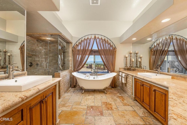 bathroom with independent shower and bath and vanity