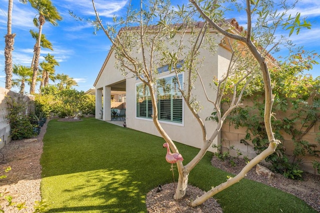 exterior space featuring a yard and a patio