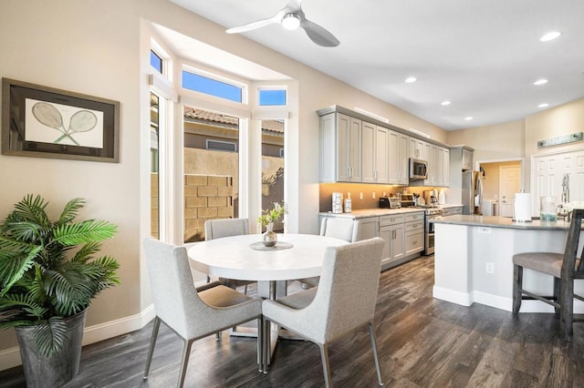 dining room featuring ceiling fan and dark hardwood / wood-style floors