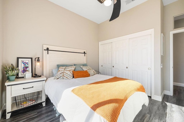 bedroom with ceiling fan, a closet, and dark hardwood / wood-style flooring