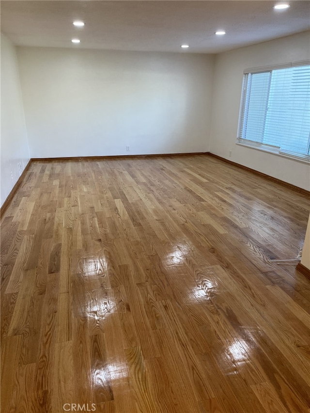 unfurnished room featuring light hardwood / wood-style floors