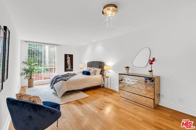 bedroom with hardwood / wood-style floors