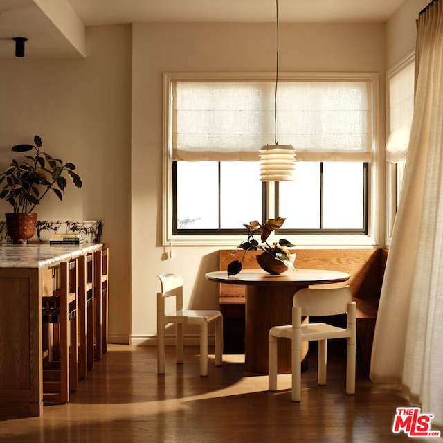 dining area with dark wood-type flooring