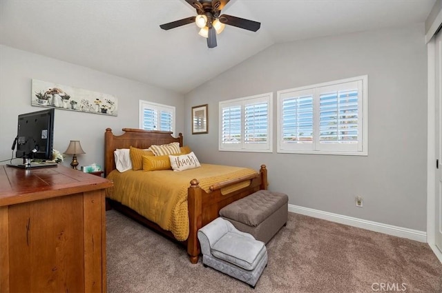 bedroom with ceiling fan, lofted ceiling, and carpet flooring