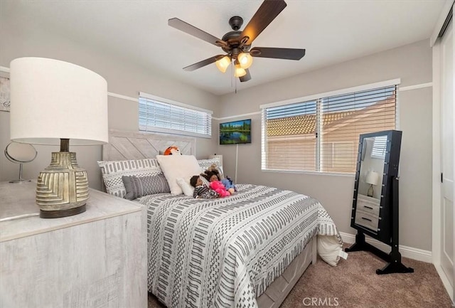 carpeted bedroom featuring ceiling fan