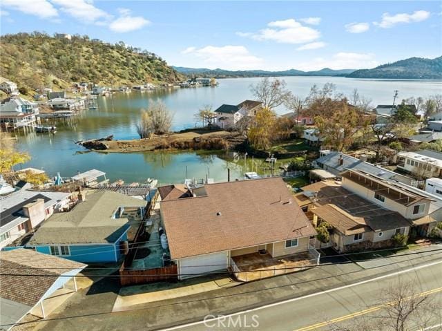 aerial view featuring a water and mountain view