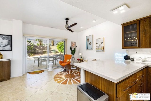 kitchen with ceiling fan and light tile patterned floors