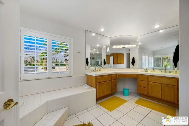 bathroom with tile patterned floors, vanity, and lofted ceiling